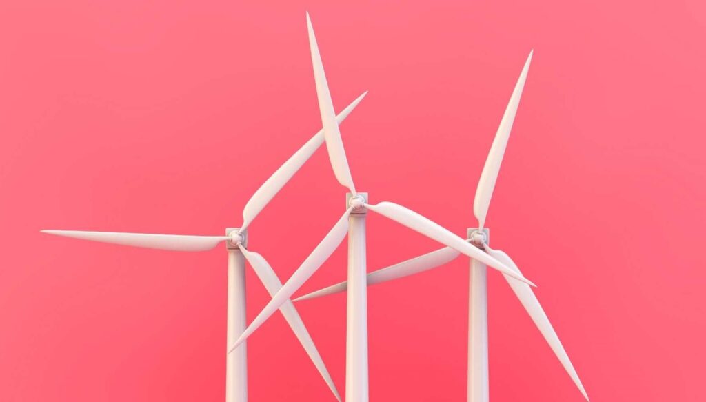 White wind turbines against a pink background